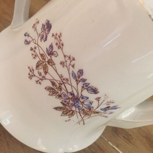 Teapot and old porcelain milk pot