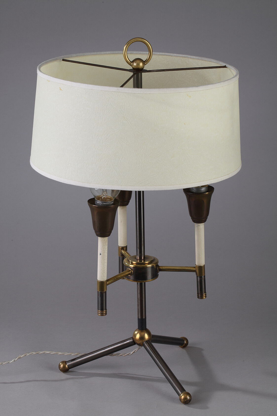 Modernist table lamp in black and gold lacquered metal