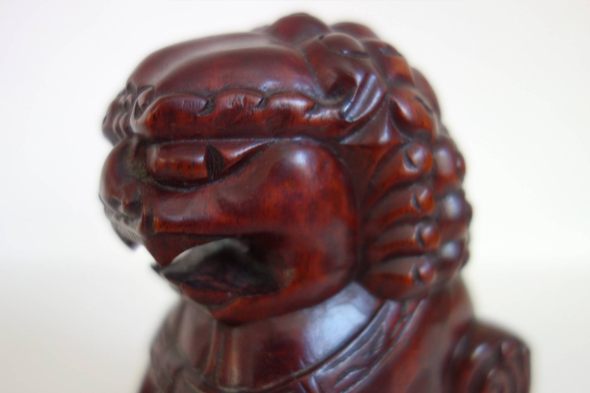 Vintage wooden pair of Foo dogs.