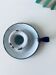 Antique candle holder in white and blue enamelled metal