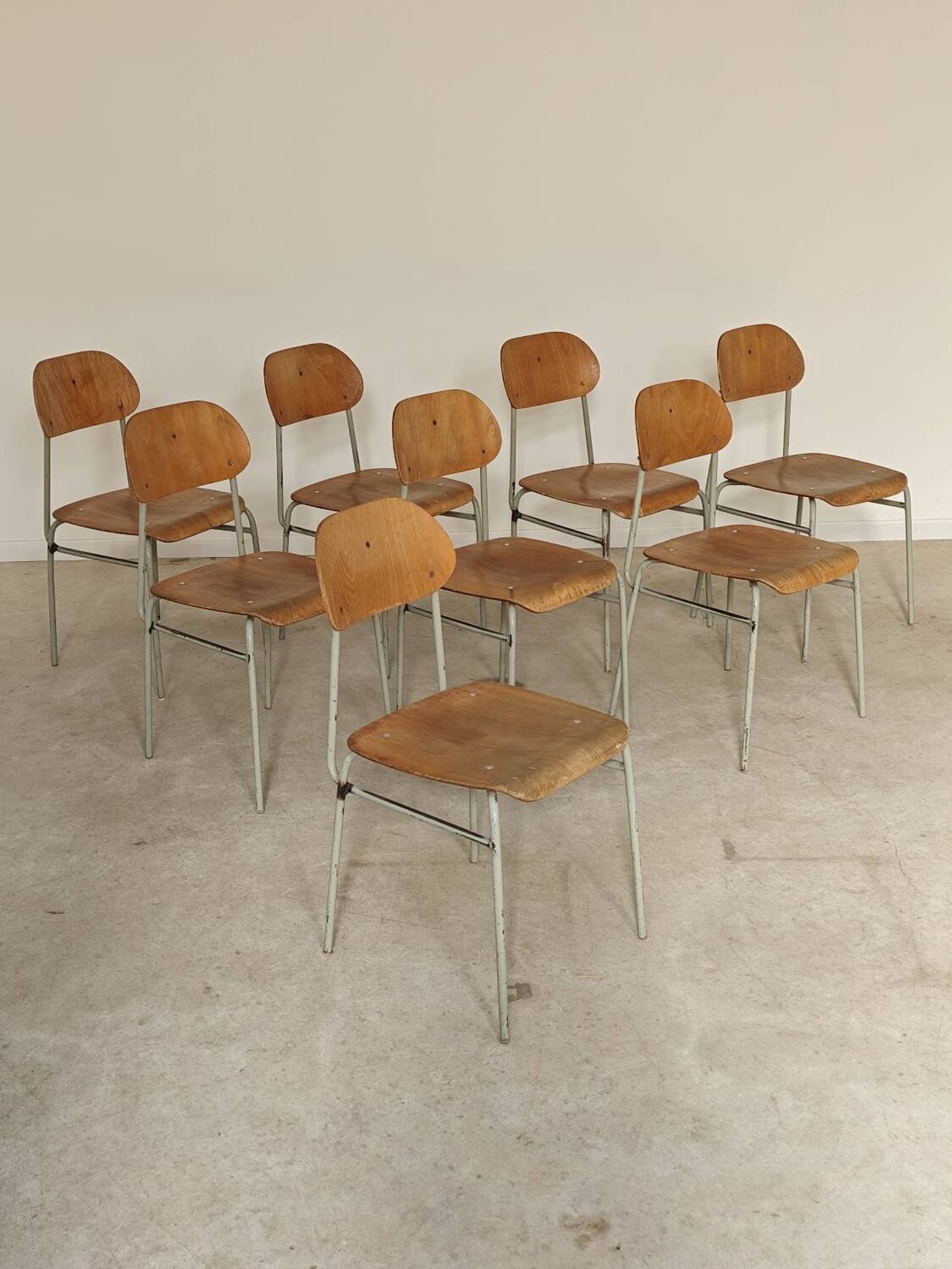Set of 8 metal and wood school chairs  
Ex Czechoslovakia 1960