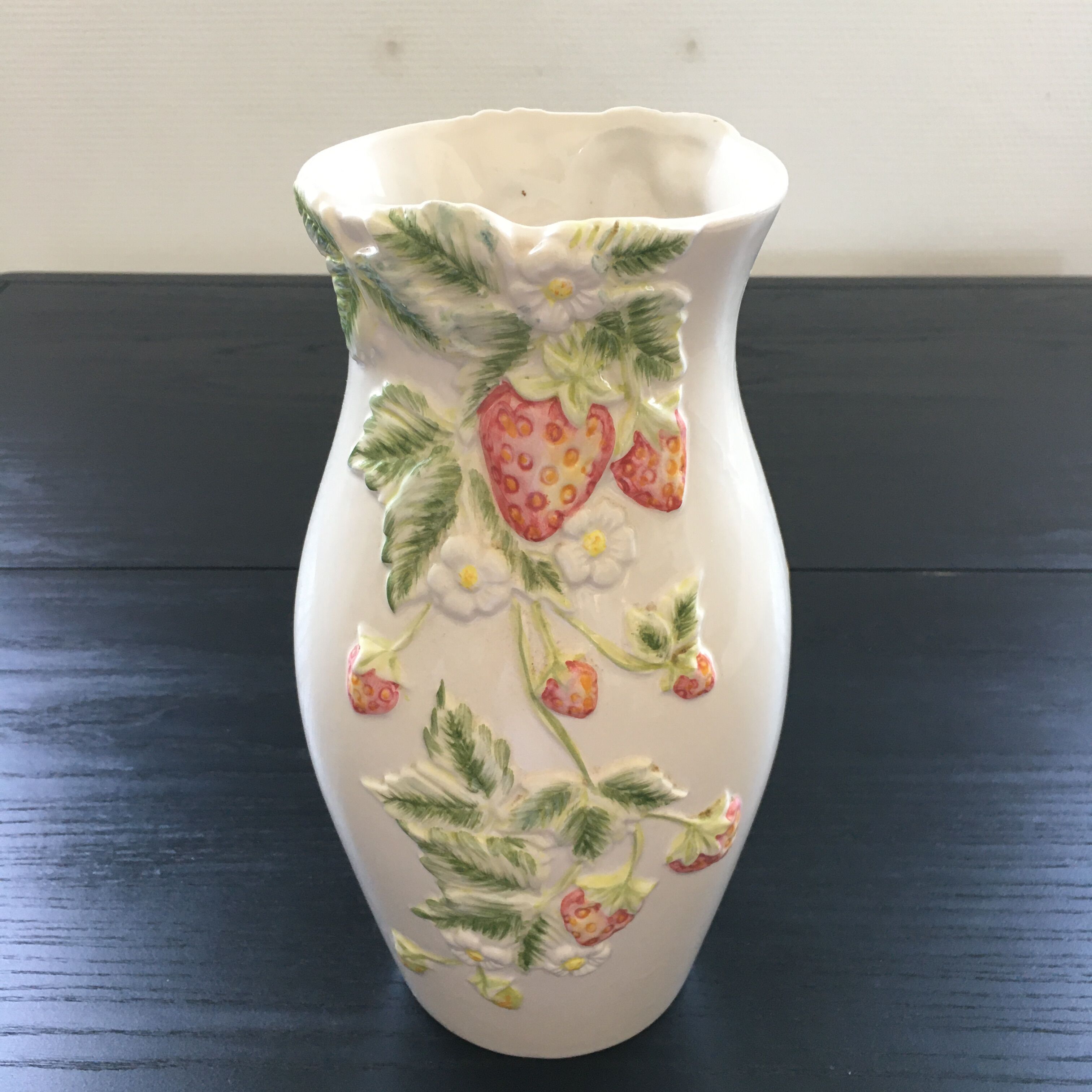 Vase decorated with strawberries in slip