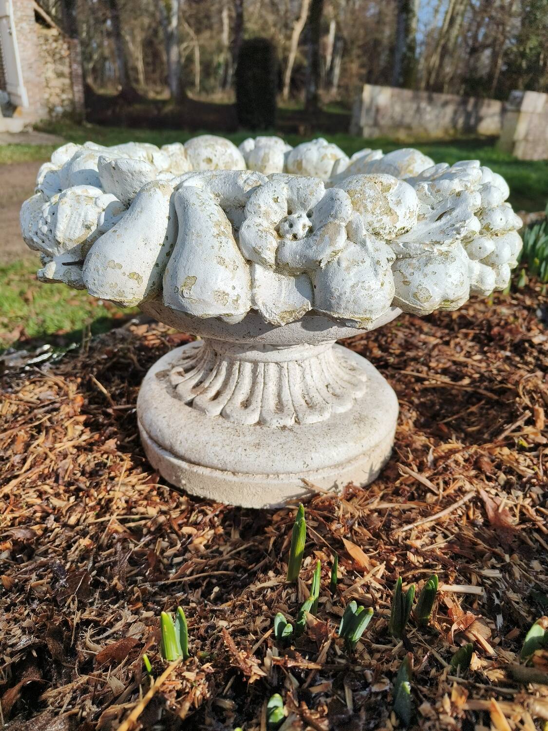 Pair of round stone fruit bowls on foot