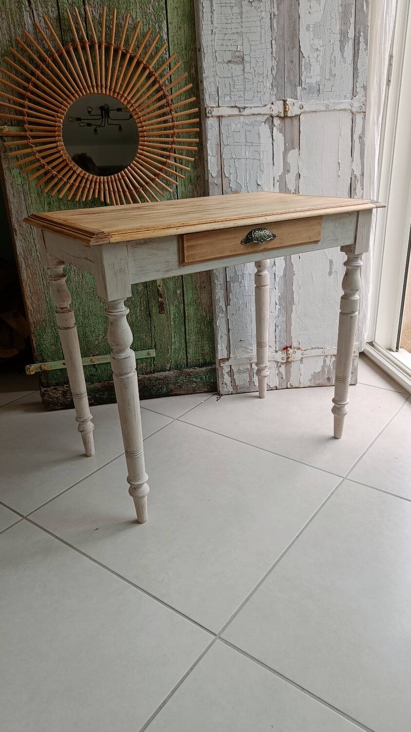 Antique wooden desk with a patinated base