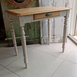 Antique wooden desk with a patinated base
