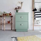 Old chest of drawers with two green drawers