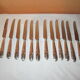 12 silver metal knives