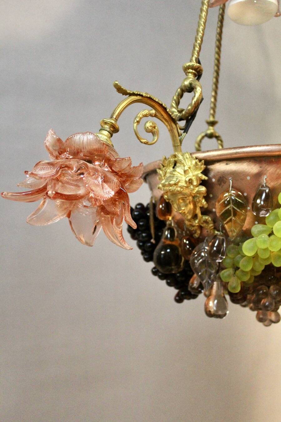 Bronze three-armed chandelier with a grape decoration.
