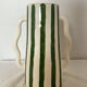 Handmade green and white striped ceramic vase with abstract corrugated handheld