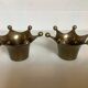 Pair of brass crown candlesticks