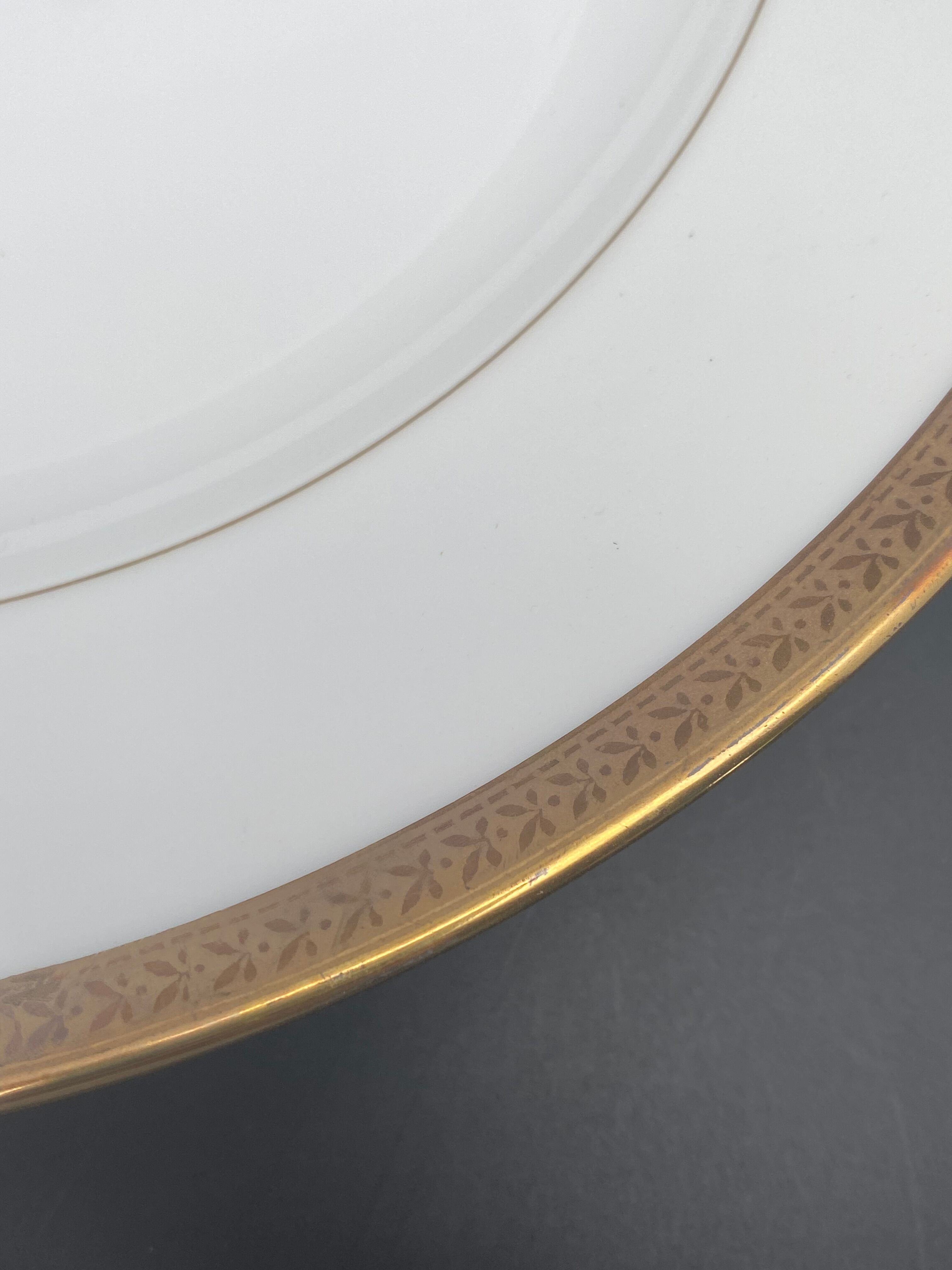 Round porcelain dish from Limoges golden tower