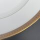 Round porcelain dish from Limoges golden tower