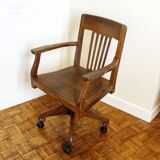 Oak wood office chair with swivel seat and swivel wheels