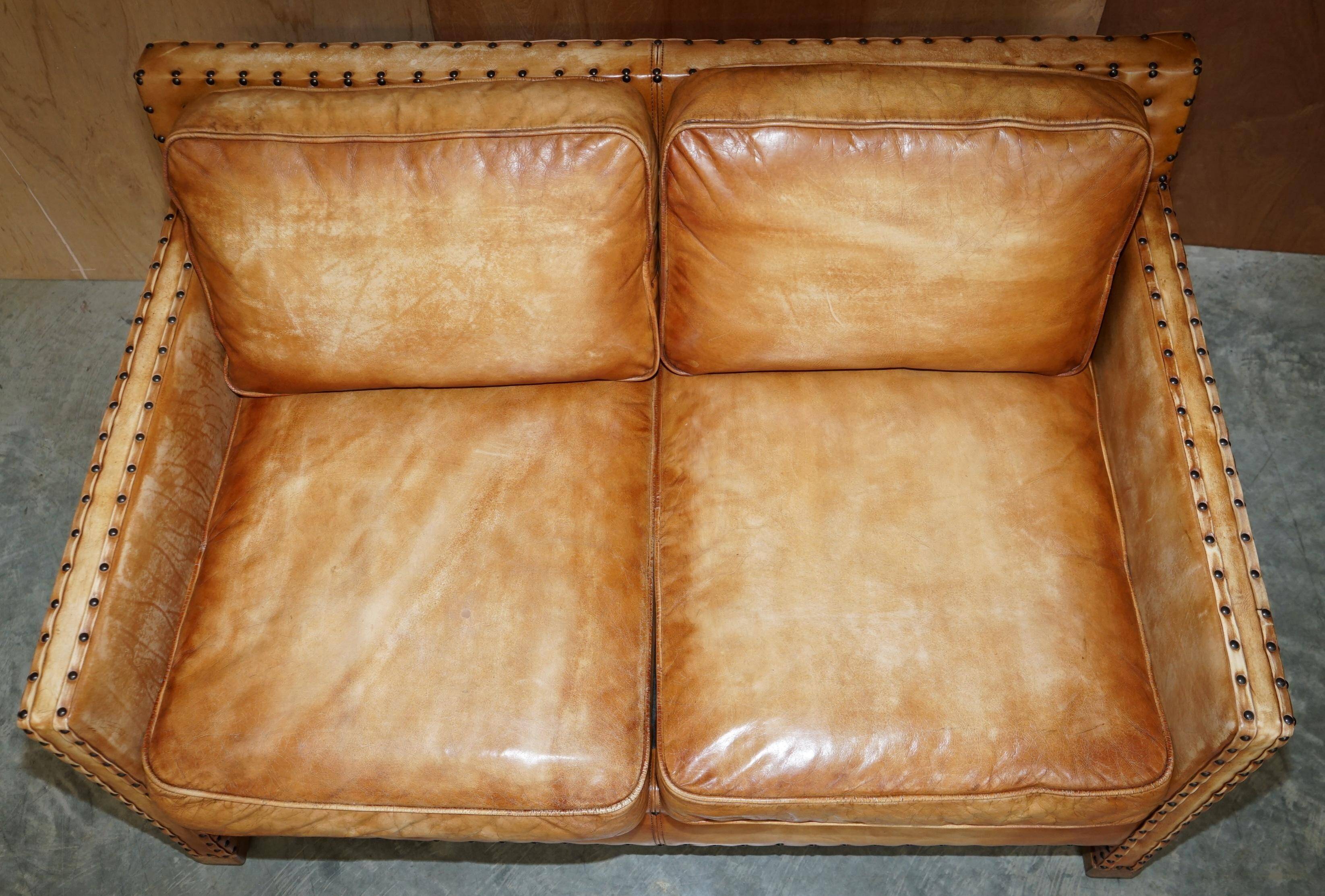 Two-seater leather canapé, hand-tanned, Edwardian style with studs.