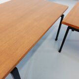 Suite of two vintage modernist Isa coffee tables in teak and black metal from the 60s