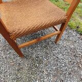 Scandinavian armchair of the 50s in cherry tree sitting in rope