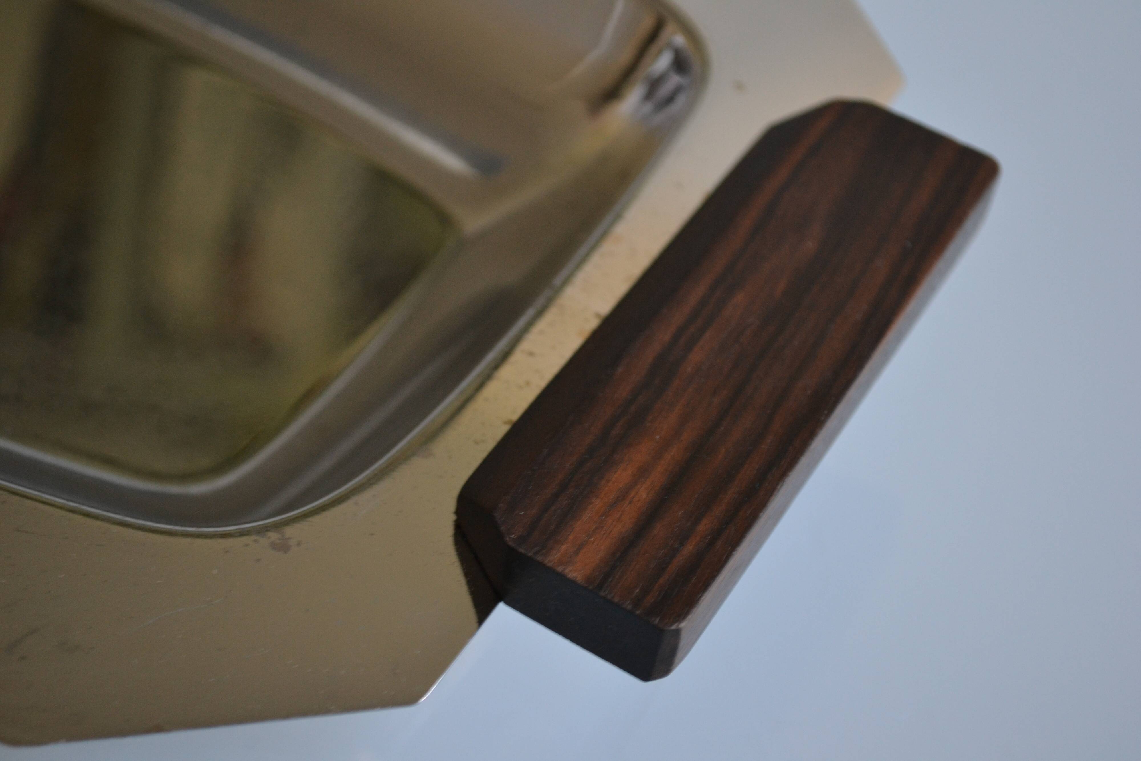 Art Deco serving dish in chrome metal with ebony handles.