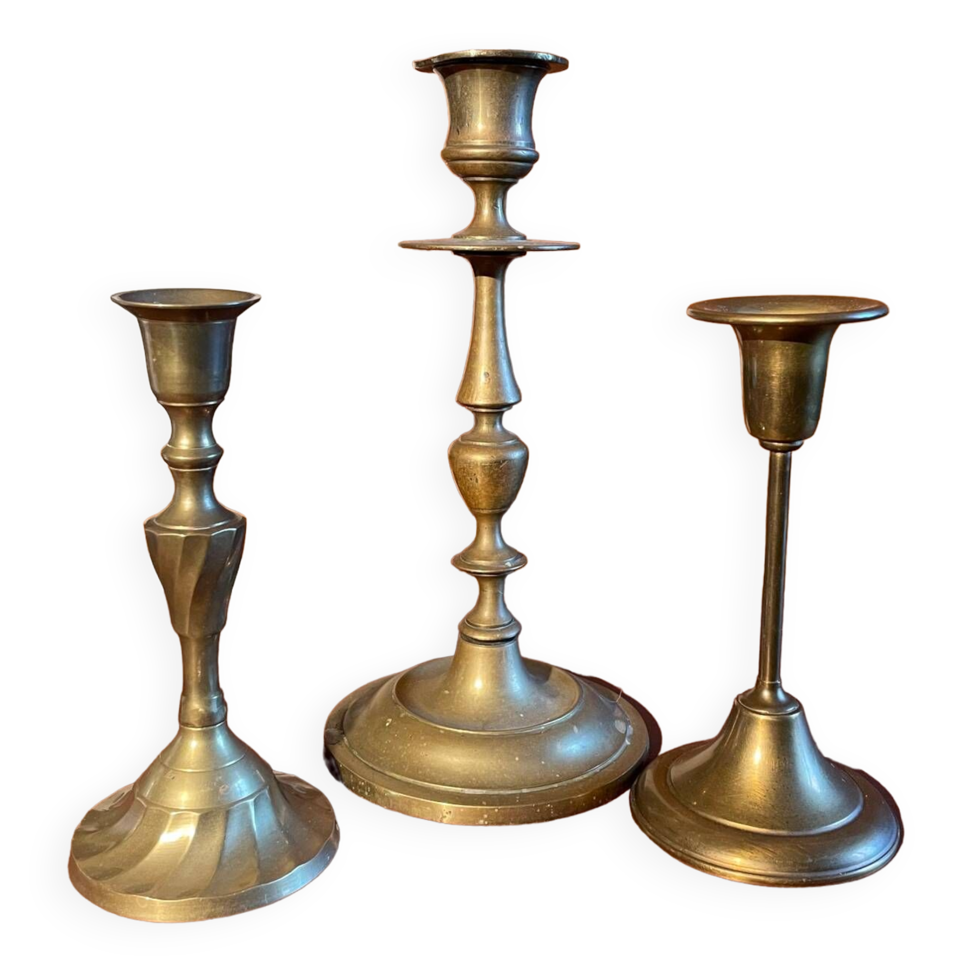 Trio of brass candlesticks