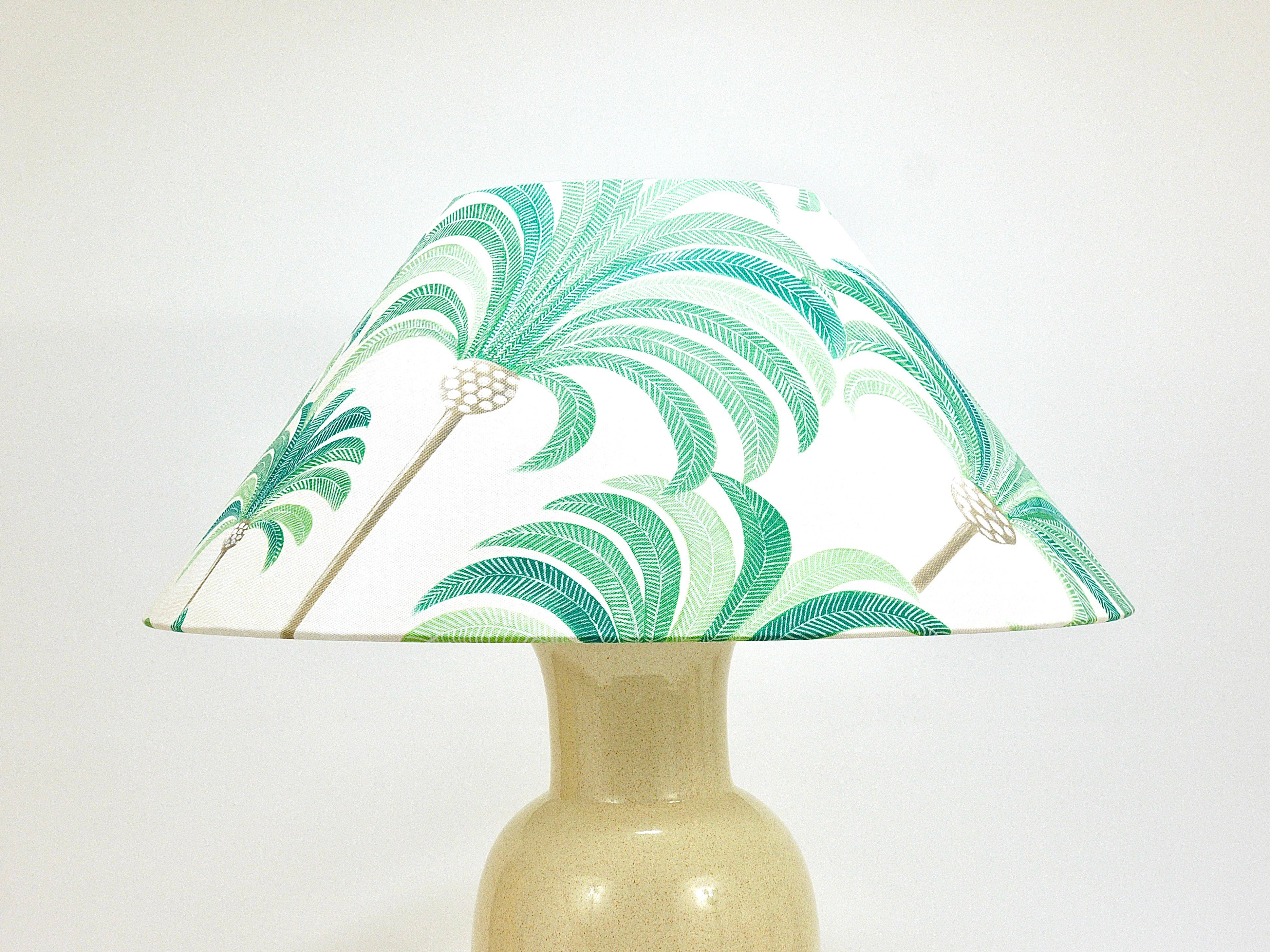 Pair of Tommaso Barbi Riviera palm tree table lamps from the 1970s with matching cushions.