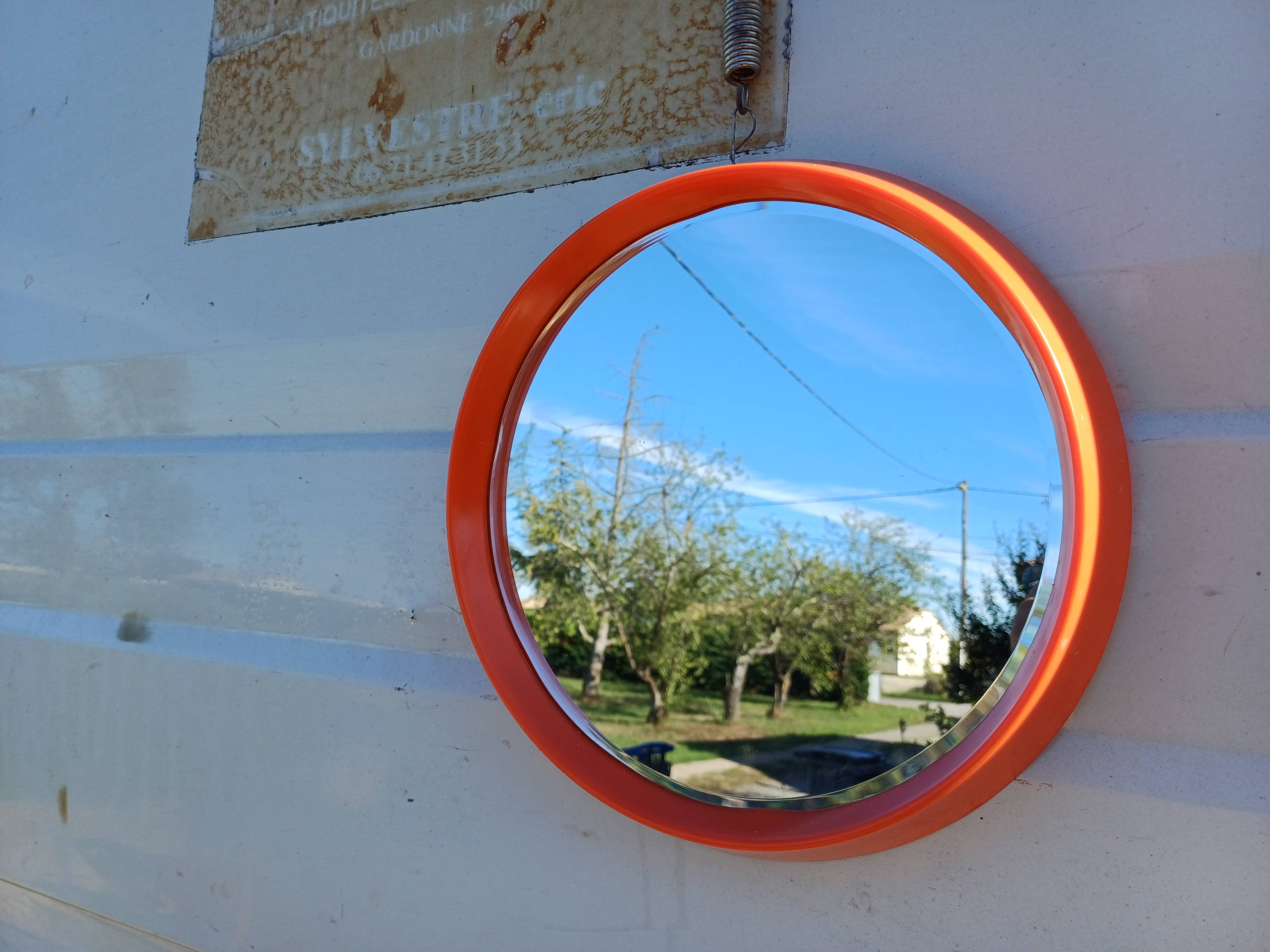 Vintage round plastic orange mirror