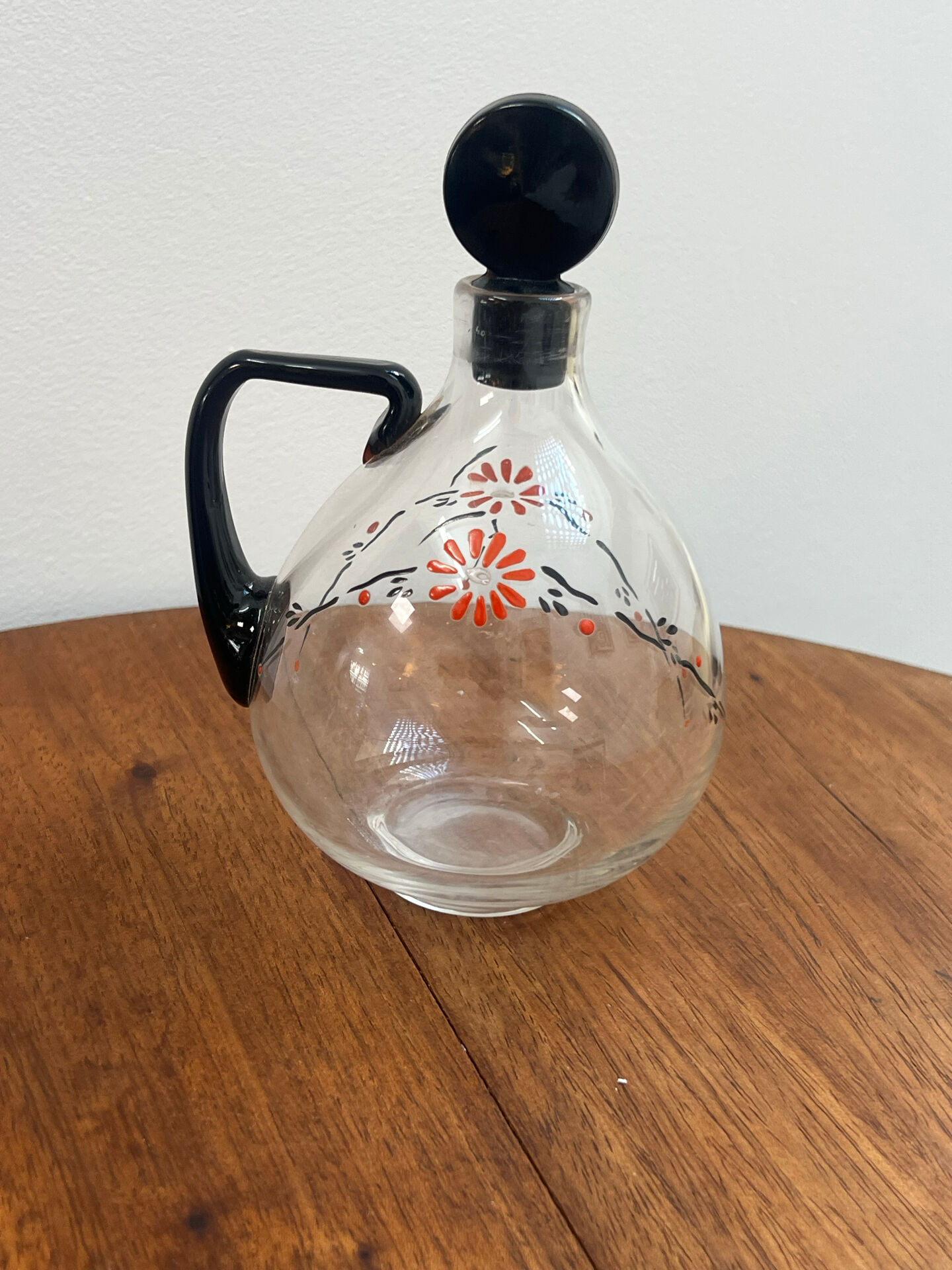 Enamelled glass carafe 1920
