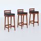 Erik Buck set of three bar stools in teak and leather Dyrlund Denmark 1960