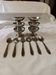 Set of 6 small ice cream bowls by Guy Degrenne in stainless steel with 6 spoons.
