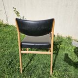 Scandinavian chair with faux leather seat and back