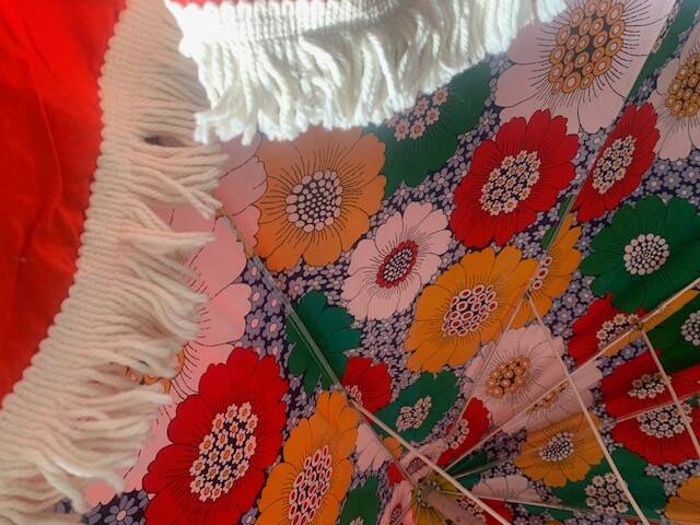 Large floral tilting beach umbrella with cotton fringes, 1960