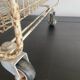Metal serving trolley on wheels
