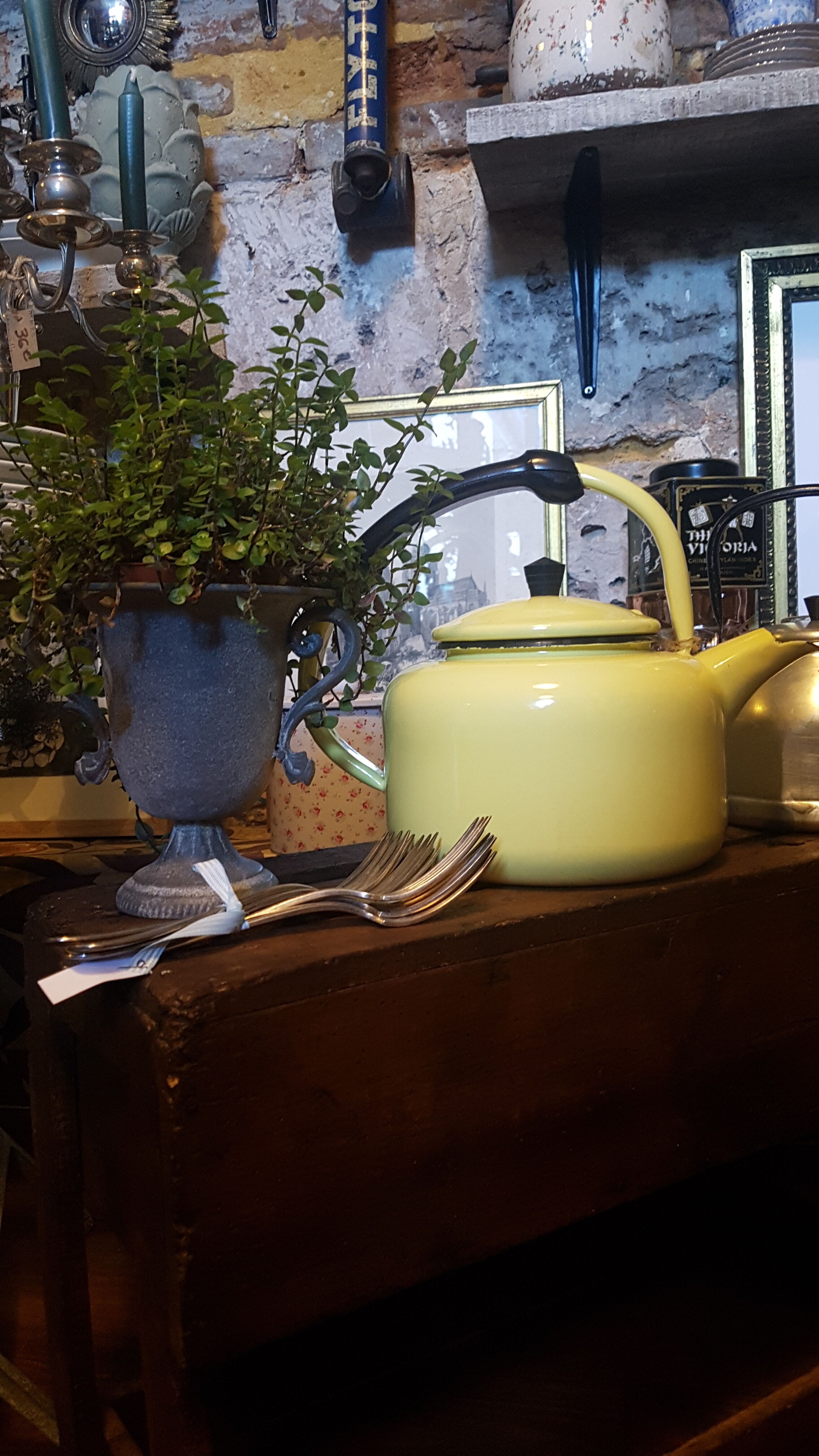 Old kettle enamelled pale yellow