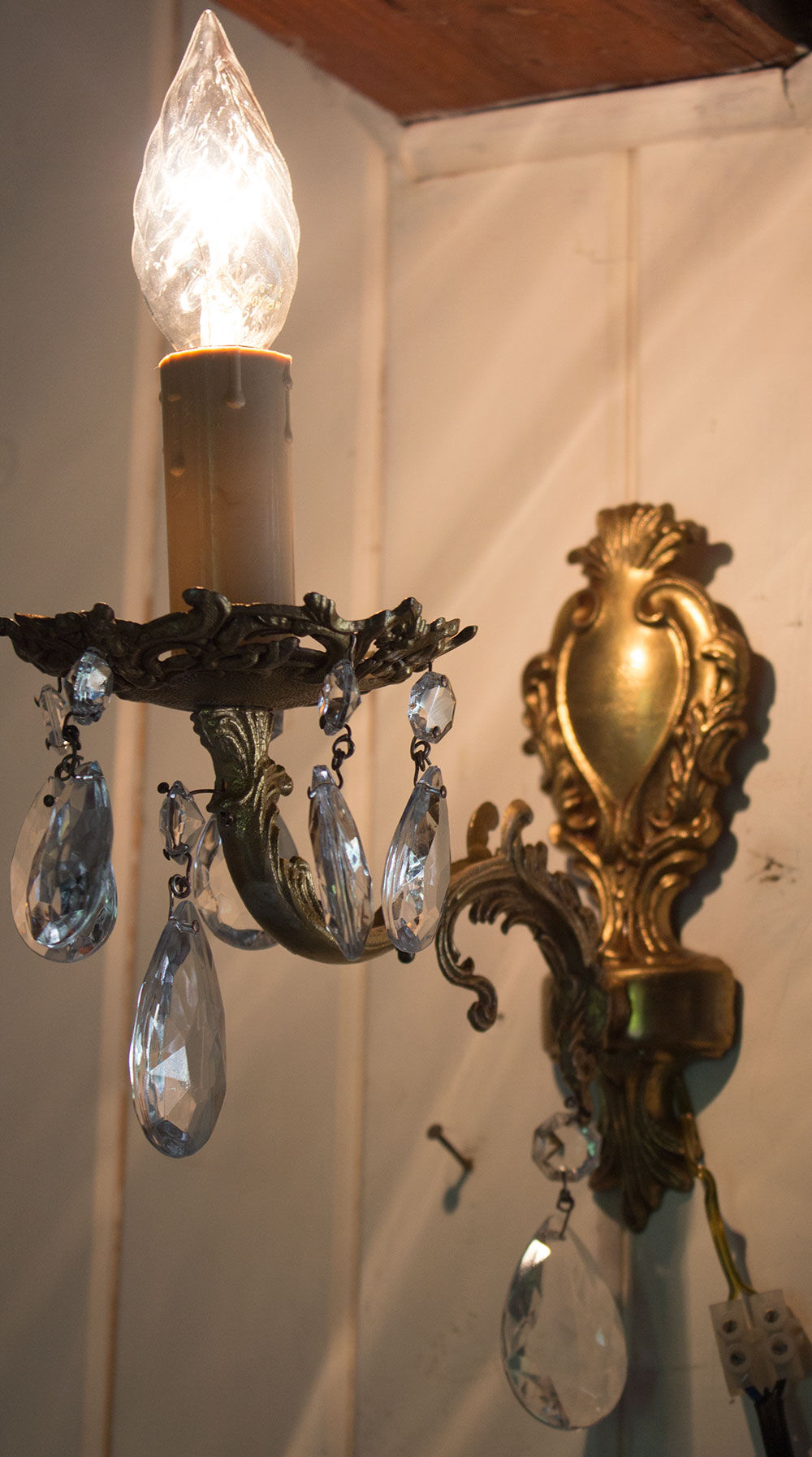 Old brass wall light with glass stamps