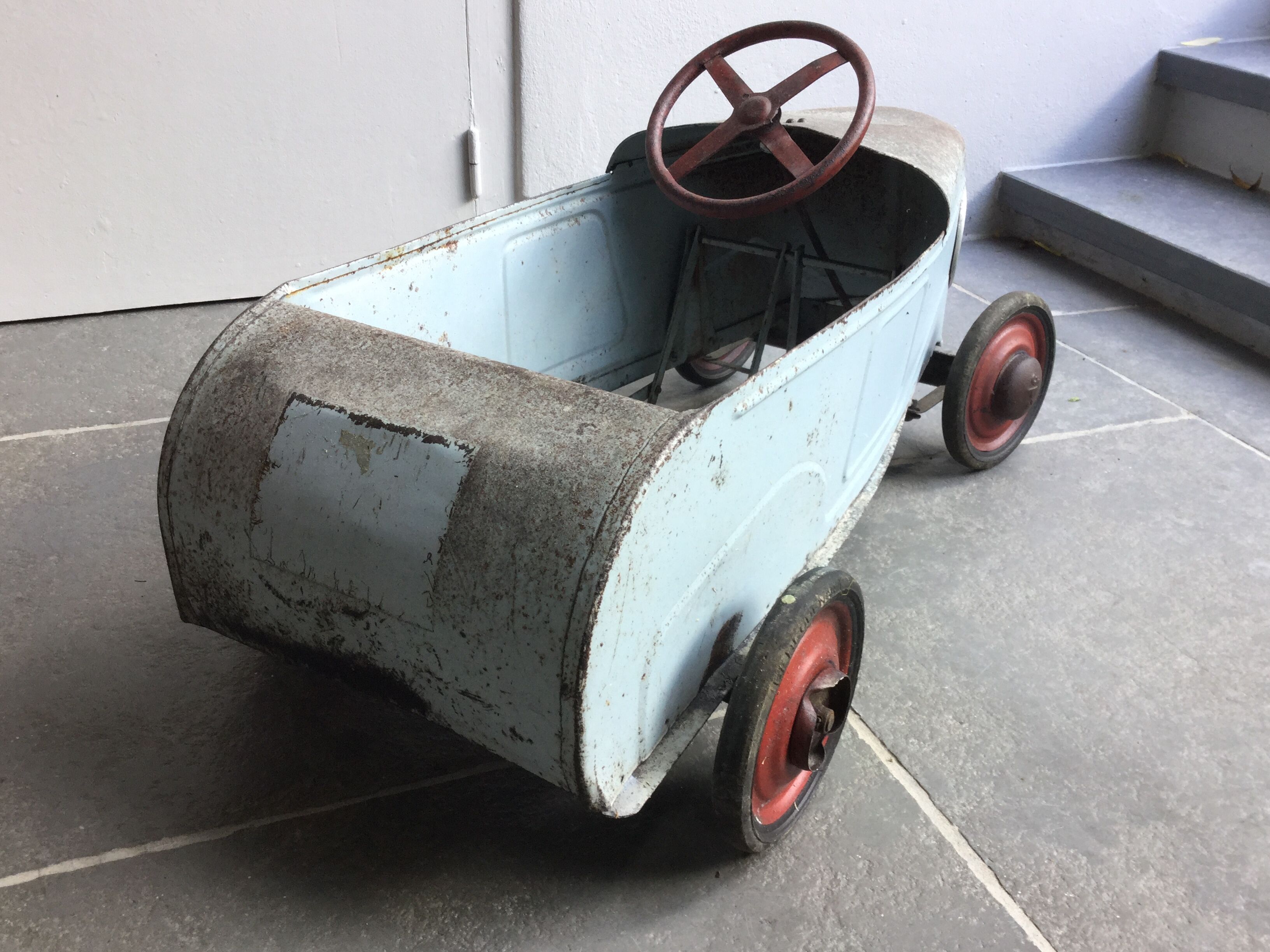 Old metal pedal car 1930