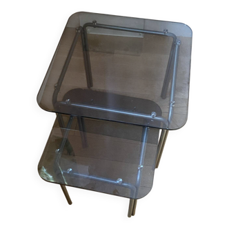 pair of smoked glass nesting tables