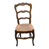 Solid oak carved chair with rush seating, Louis XV style, 19th century.