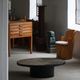 Round brutalist coffee table in stone and steel, mid-century French modernism, 1970s.