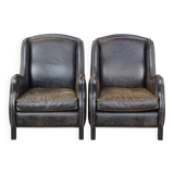 Set of 2 black cow leather armchairs finished with decorative nails, industrial style