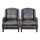 Set of 2 black cow leather armchairs finished with decorative nails, industrial style
