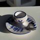Dutch white and blue candlestick with windmill pattern.