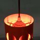 Vintage orange suspension light in a 1970s space age style.