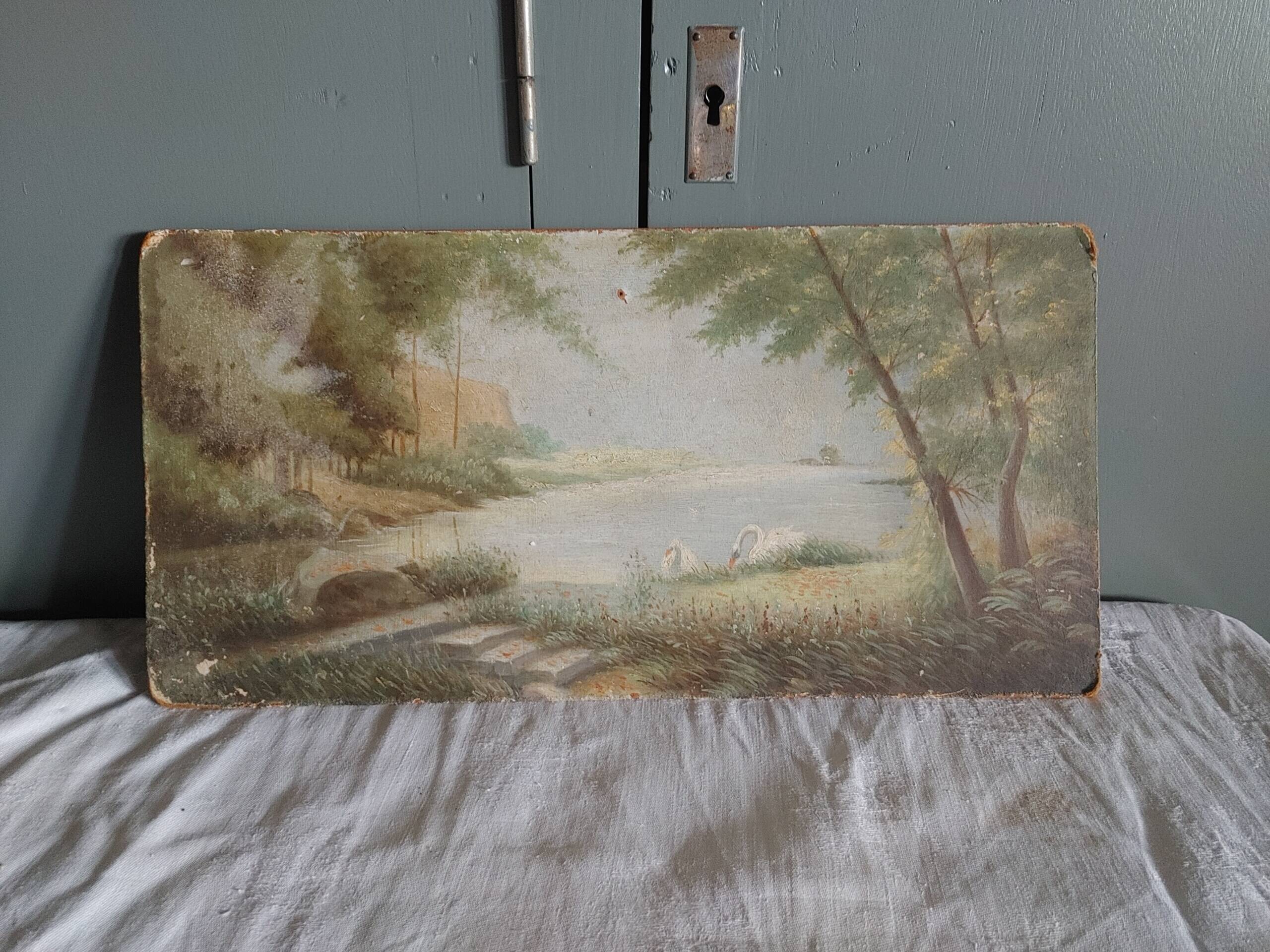 Old oil on rigid cardboard depicting swans on the water