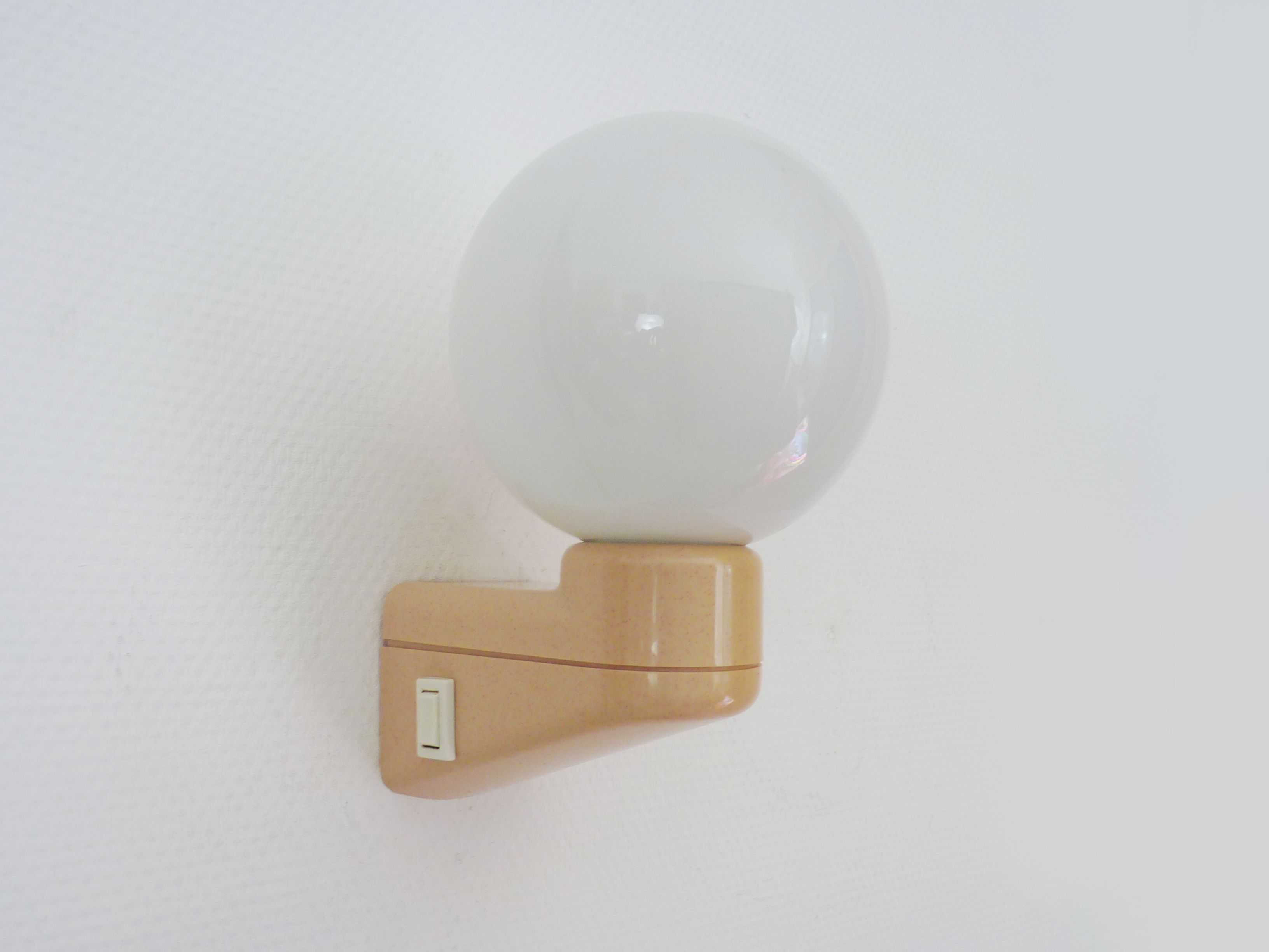 Vintage wall lamp in beige pvc with pink dot and globe in white opaline. Year 70