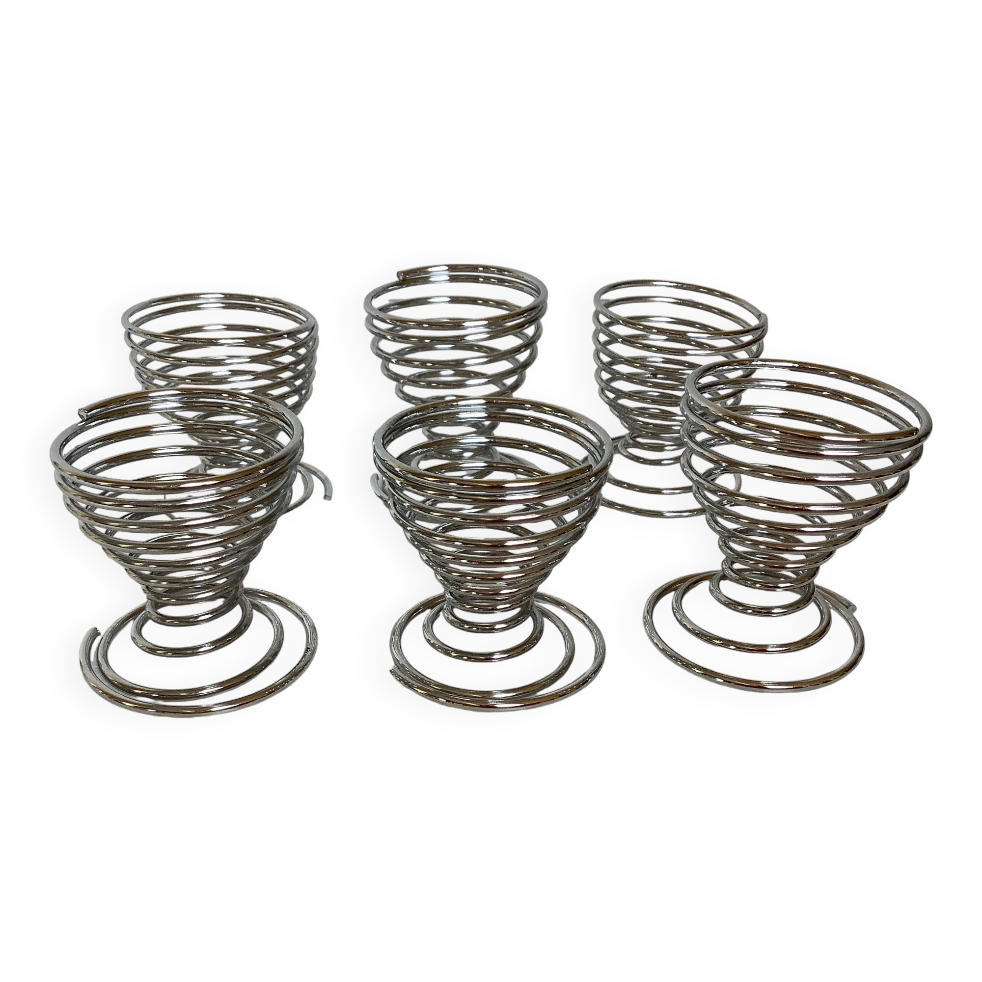 Six metal spiral spring egg cups