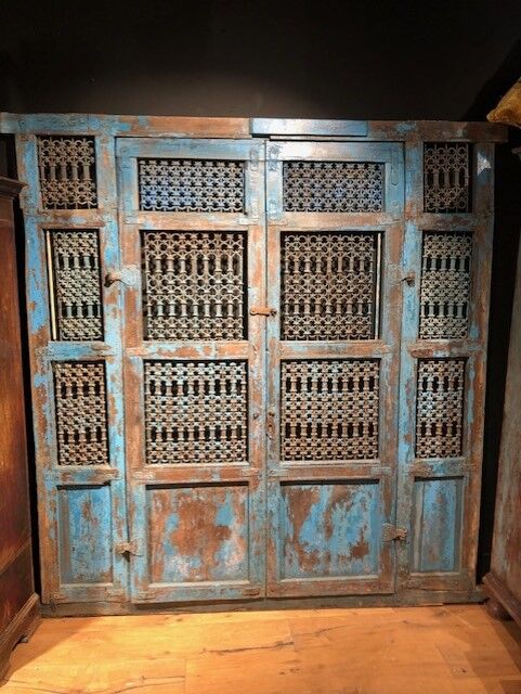 Openwork indian door in metal and blue wood