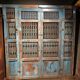 Openwork indian door in metal and blue wood