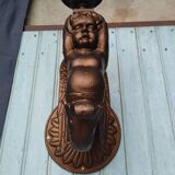 Paire de torchères murales putti en fonte