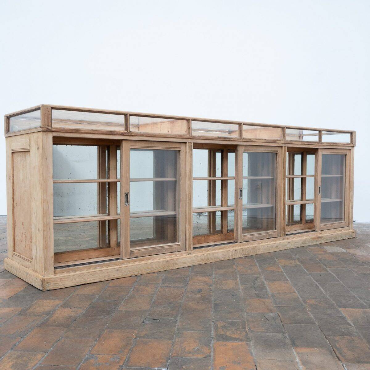 Old glass-fronted pine trade counter - early 20th century