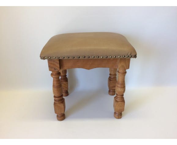 Rustic tabouret on leather