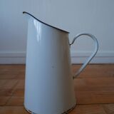 White enamelled metal broc