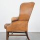 Fauteuil Chesterfield anglais classique en cuir de vachette couleur cognac clair